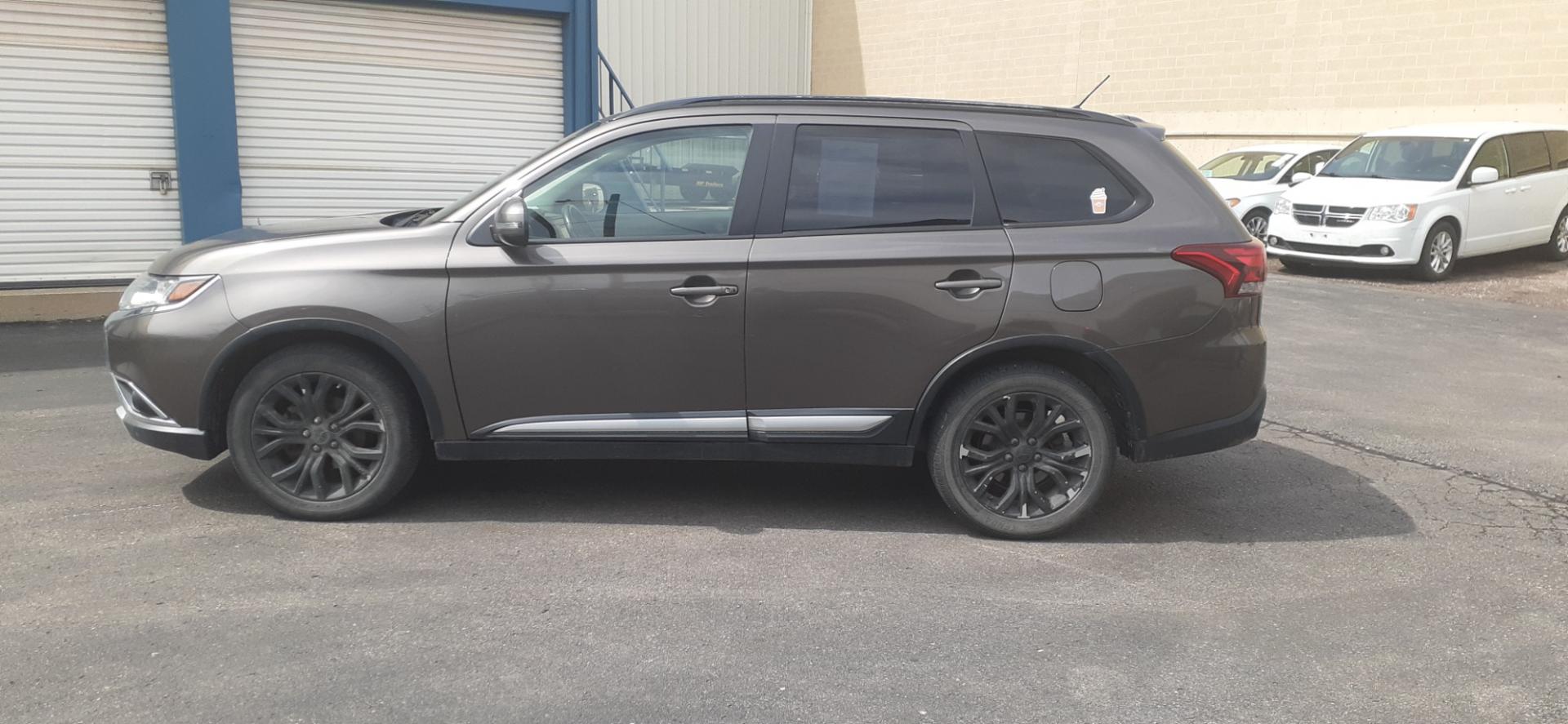 2016 Mitsubishi Outlander SE AWD (JA4AZ3A37GZ) with an 2.4L L4 DOHC 16V engine, CVT transmission, located at 2015 Cambell Street, Rapid City, SD, 57701, (605) 342-8326, 44.066433, -103.191772 - CARFAX AVAILABLE - Photo#0